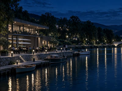 The boathouse at dusk, boats at the jetty and the bridge beyond